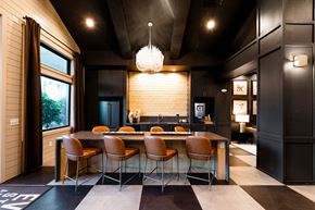 Southport apartment for rent - A modern dining room with a large table and chairs.