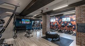 Winston Salem apartment for rent - a gym with exercise equipment and a wall mural of a basketball game