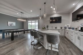 Pike Road apartment for rent - A modern kitchen with a dining table and bar stools.