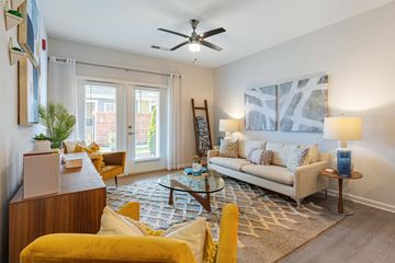 Simpsonville apartment for rent - a living room with a couch and a ceiling fan