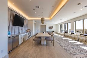 La Porte apartment for rent - A modern kitchen with a dining table and chairs.