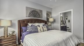 Winston Salem apartment for rent - a bedroom with a large bed and a door to a bathroom