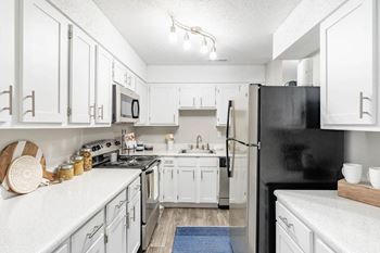 Designer cabinetry with white finishes*