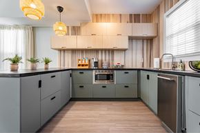 Durham apartment for rent - a kitchen with gray cabinets and a wood floor