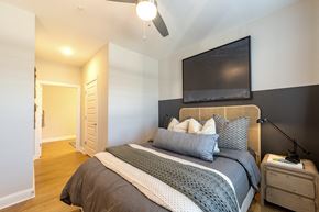 Myrtle Beach apartment for rent - a bedroom with a bed and a tv on the wall