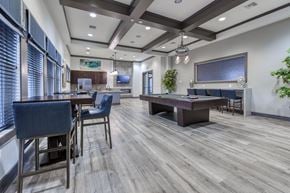 Jacksonville apartment for rent - A modern dining room with a wooden floor and a large table.