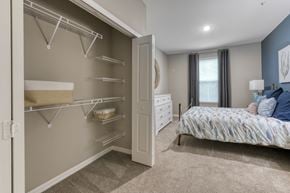 Jacksonville apartment for rent - A bedroom with a large bed and a walk-in closet.