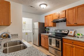 Fayetteville apartment for rent - a kitchen with granite counter tops and stainless steel appliances