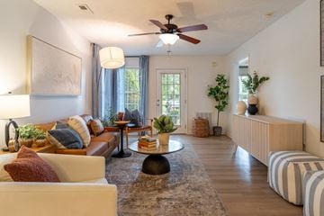 Fayetteville apartment for rent - a living room with a ceiling fan and a couch