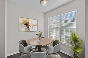 Greensboro apartment for rent - A dining room with a round table and chairs at Hawthorne Bridford in Greensboro, NC