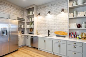 Winterville apartment for rent - a kitchen with white cabinets and a stainless steel refrigerator