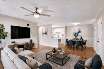 Knoxville apartment for rent - A living room with a white couch and a black coffee table.
