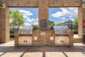 Holly Springs apartment for rent - two bbq pits on the side of a brick building
