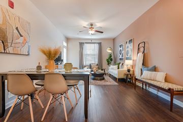 Holly Springs apartment for rent - a living room with a dining room table and a ceiling fan