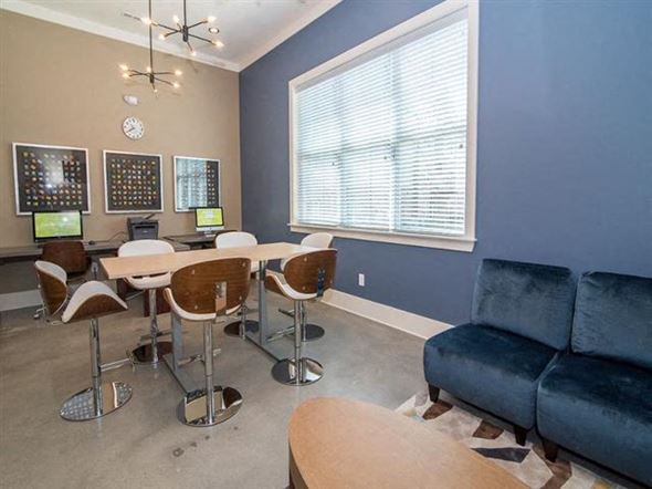 Jamestown apartment for rent - a living room with a table and a couch