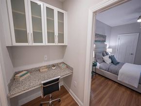 Oak Island apartment for rent - a bedroom with a desk and a bed