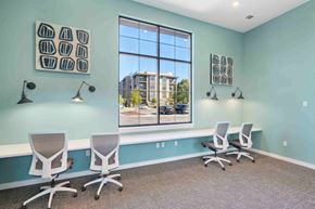 Raleigh apartment for rent - an office with three chairs and a large window