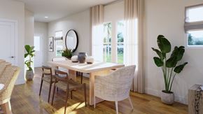 Calabash apartment for rent - a dining room with a table and chairs and a window