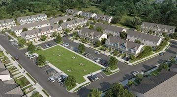Leland townhouse for rent - A large, well-maintained apartment complex with a green lawn and multiple buildings.