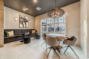 Wake Forest apartment for rent - a dining room with a table and chairs and a large window