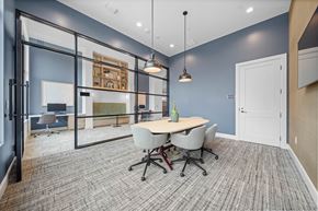 Cary apartment for rent - A conference room with a table and chairs.