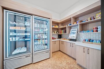 Cary apartment for rent - A modern kitchen with a refrigerator and a counter.