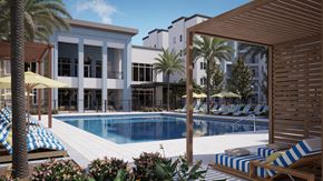 Winter Garden apartment for rent - a swimming pool in front of a building with palm trees