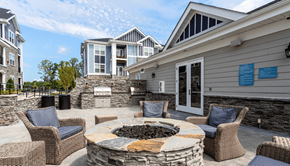 Fuquay-Varina apartment for rent - the preserve at ballantyne commons patio with fire pit and chairs