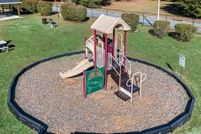 Hope Mills apartment for rent - a playground with a slide and other toys in a park