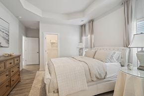 Longs apartment for rent - A bedroom with windows and a door to a bathroom at 15 at Heron apartments in Longs, SC.
