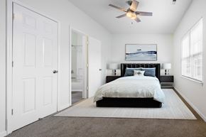 Holly Springs apartment for rent - a bedroom with a bed and a ceiling fan