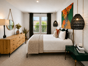 Kissimmee apartment for rent - A bedroom with a large bed, a wooden dresser, and a green side table.