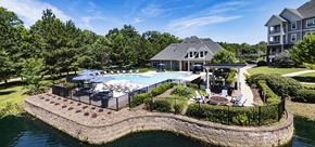 Vestavia Hills apartment for rent - A large house with a pool and a hot tub on a landscaped island.