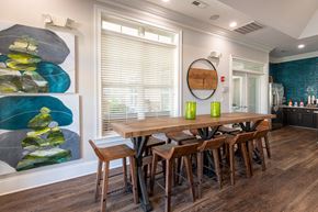 Fayetteville apartment for rent - a dining room with a wooden table and chairs