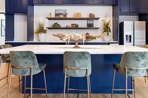 Hendersonville apartment for rent - Large kitchen with blue cabinets and a white island with three chairs.