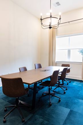 Hendersonville apartment for rent - A conference room with a long table and chairs.
