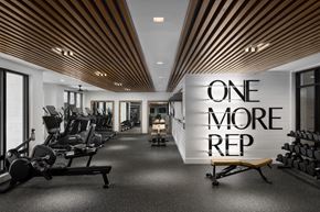 Fort Myers apartment for rent - A gym with a sign that says "one more rep".
