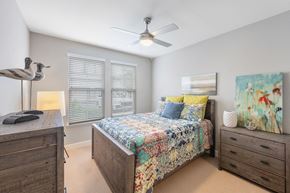Rosemary Beach apartment for rent - a bedroom with a bed and a ceiling fan