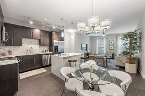 Jacksonville apartment for rent - a kitchen and dining room with a glass table and chairs