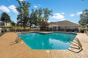 High Point apartment for rent - a swimming pool with a house in the background