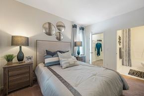 High Point apartment for rent - our apartments offer a bedroom with a large bed and a walk in closet