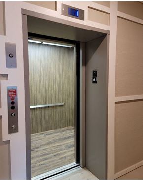 New Bern apartment for rent - an open door to a elevator in a building