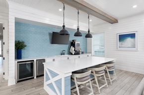 Wilmington townhouse for rent - A kitchen with a white counter and blue tiles.