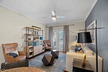 Greensboro apartment for rent - A living room with a brown leather chair and a wooden coffee table.