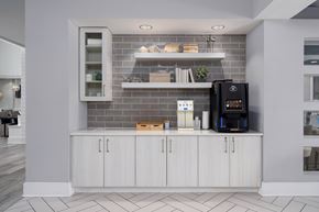 Wilmington apartment for rent - A modern kitchen with a white cabinet and a black coffee maker.