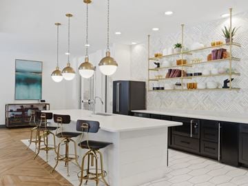 Chattanooga apartment for rent - A kitchen with a white counter and black bar stools.