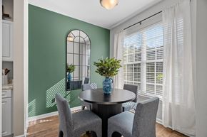Greensboro apartment for rent - A dining room with a round table and grey chairs.