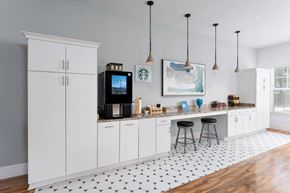 Wilmington apartment for rent - A kitchen with white cabinets and a black and white tiled floor.