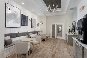 New Bern apartment for rent - A modern kitchen with a dining table and chairs.