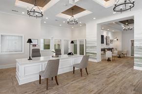 New Bern apartment for rent - A well-lit, spacious office with a desk and chairs.